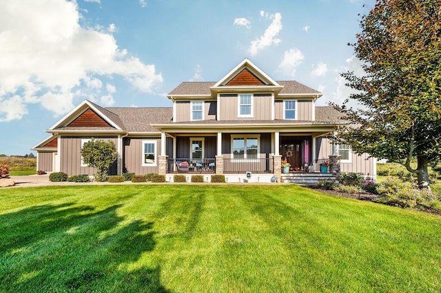 2753 Colton Dr, Berrien Springs, MI 49103 - craftsman house featuring board and batten siding, covered porch, and a front lawn