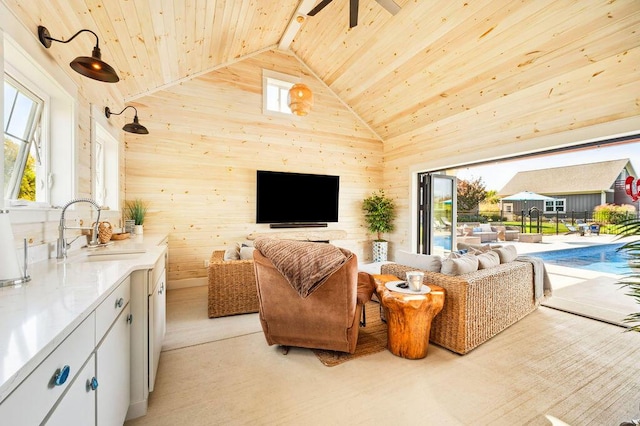 2753 Colton Dr, Berrien Springs, MI 49103 - living area with wood ceiling, a ceiling fan, wooden walls, and high vaulted ceiling