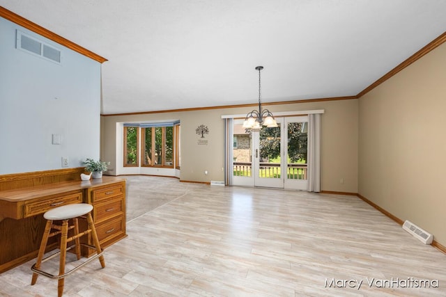1861 Elizabeth Ln E, Jenison, MI 49428 - kitchen with ornamental molding, light wood-style floors, a chandelier, and decorative light fixtures