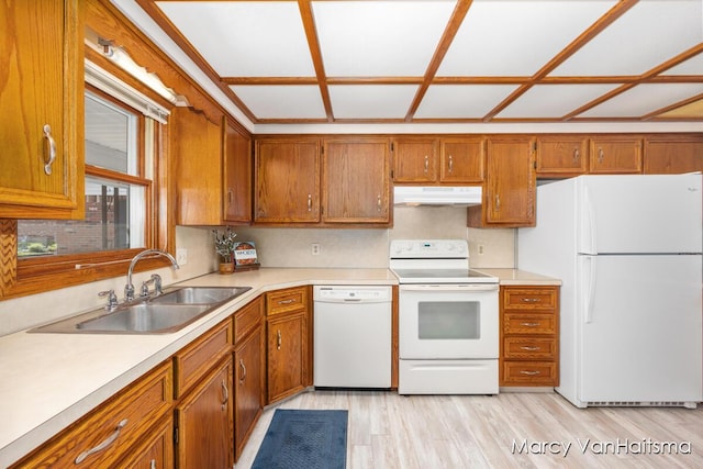 1861 Elizabeth Ln E, Jenison, MI 49428 - kitchen featuring white appliances, under cabinet range hood, brown cabinetry, and light countertops