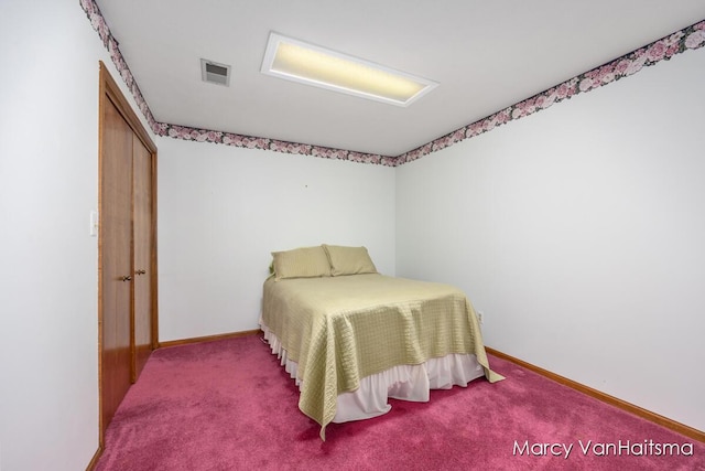 1861 Elizabeth Ln E, Jenison, MI 49428 - carpeted bedroom featuring baseboards and attic access