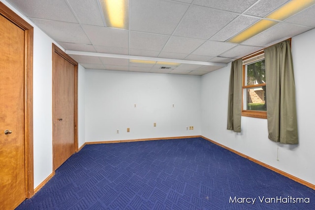1861 Elizabeth Ln E, Jenison, MI 49428 - empty room with a paneled ceiling and dark colored carpet