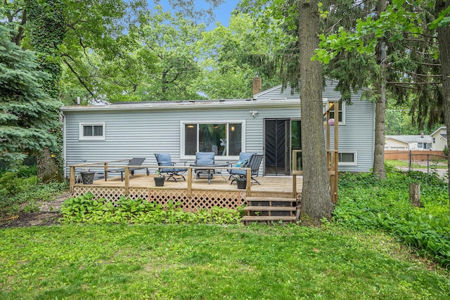 3923 Perry Ave SW, Wyoming, MI 49519 - rear view of property featuring a chimney and a wooden deck