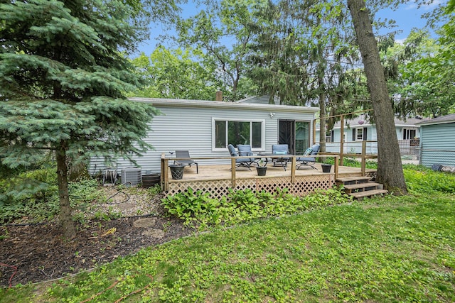 3923 Perry Ave SW, Wyoming, MI 49519 - back of house with a deck and a lawn