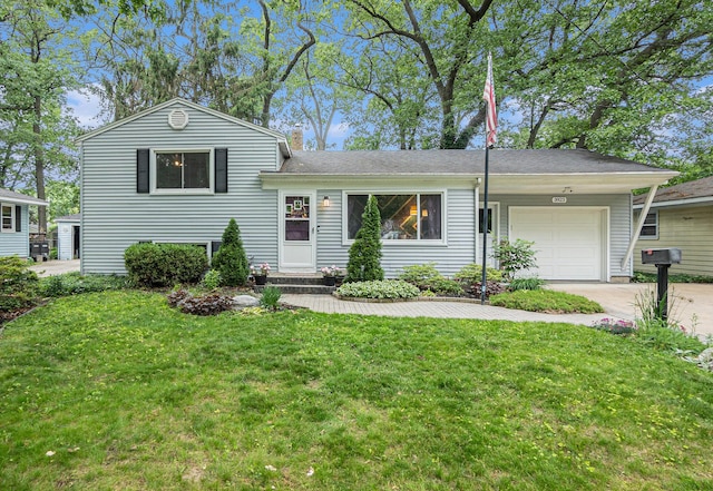 3923 Perry Ave SW, Wyoming, MI 49519 - tri-level home featuring an attached garage, driveway, a front yard, and a chimney