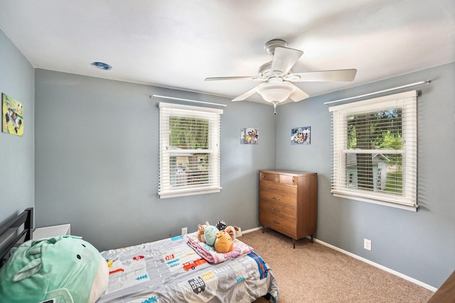 3923 Perry Ave SW, Wyoming, MI 49519 - carpeted bedroom featuring a ceiling fan and baseboards