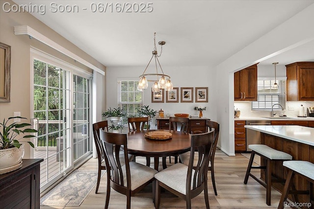 372 Four Seasons Dr, Lake Orion, MI 48360 - dining room with light wood-style floors, plenty of natural light, and a chandelier