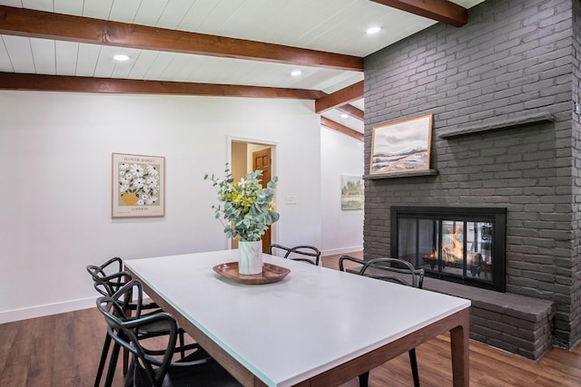 3737 Peach Ridge Ave NW, Grand Rapids, MI 49544 - dining area featuring beamed ceiling, dark wood-style floors, a fireplace, and recessed lighting