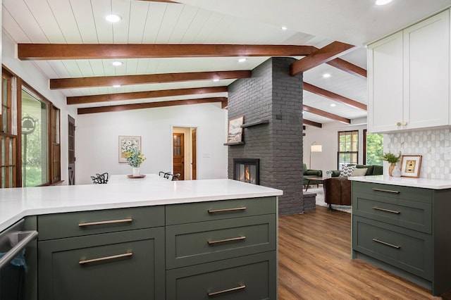 3737 Peach Ridge Ave NW, Grand Rapids, MI 49544 - kitchen with light countertops, light wood finished floors, a fireplace, recessed lighting, and white cabinetry