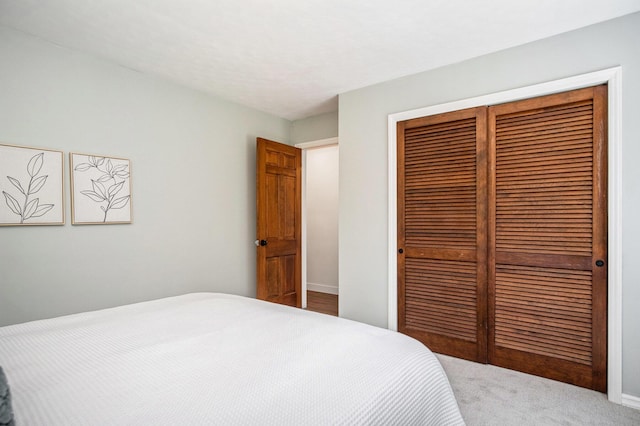 3737 Peach Ridge Ave NW, Grand Rapids, MI 49544 - bedroom with a closet and carpet floors