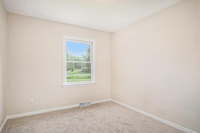 3737 Peach Ridge Ave NW, Grand Rapids, MI 49544 - carpeted empty room featuring baseboards