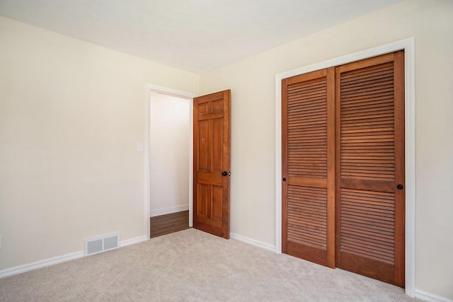 3737 Peach Ridge Ave NW, Grand Rapids, MI 49544 - unfurnished bedroom featuring a closet and carpet