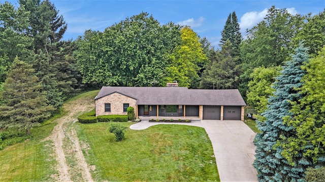3737 Peach Ridge Ave NW, Grand Rapids, MI 49544 - view of front of property featuring an attached garage, driveway, covered porch, a front yard, and a shingled roof