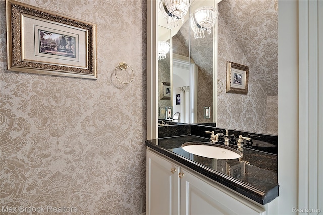 7428 Foxburg Ct, Clarkston, MI 48348 - bathroom featuring wallpapered walls and vanity