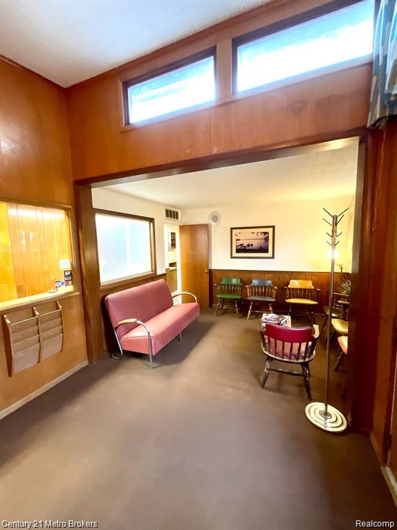 106 N Marquette St, Durand, MI 48429 - living area with wooden walls