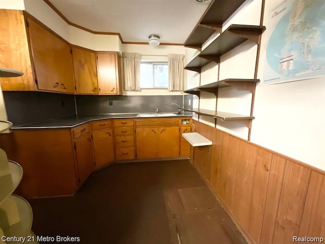 106 N Marquette St, Durand, MI 48429 - kitchen with open shelves, wainscoting, decorative backsplash, brown cabinets, and crown molding