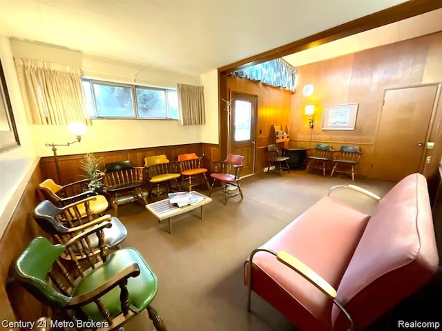 106 N Marquette St, Durand, MI 48429 - carpeted living area featuring wood walls and a wainscoted wall