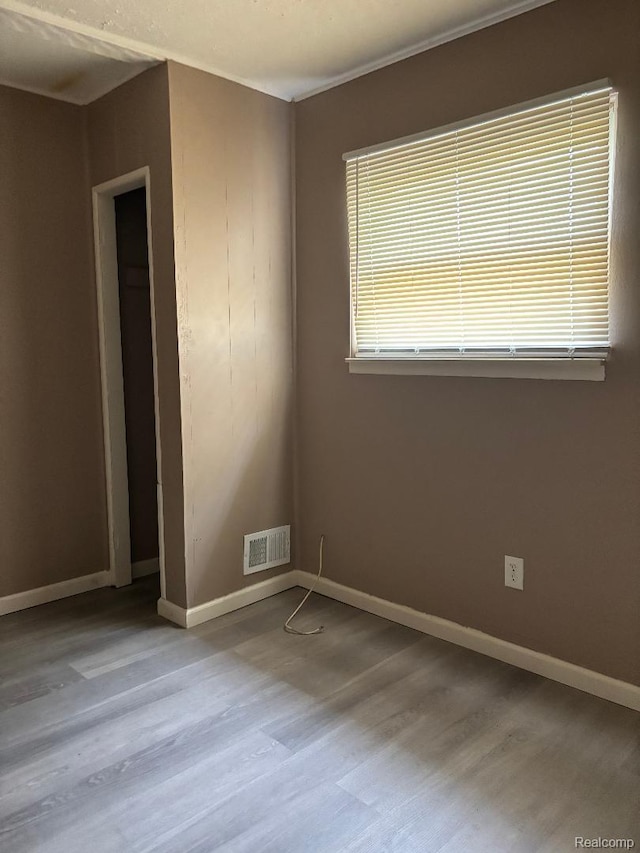6303 Duncan St, Taylor, MI 48180 - unfurnished room featuring wood finished floors and baseboards