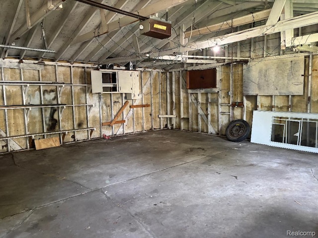 6303 Duncan St, Taylor, MI 48180 - garage featuring a garage door opener