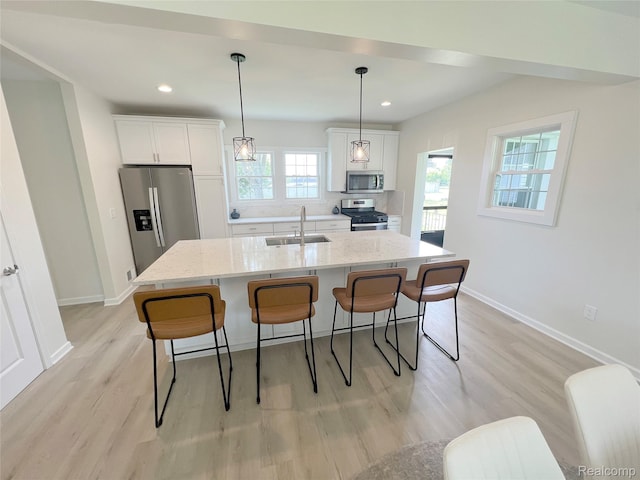 19904 Mckinnon St, Roseville, MI 48066 - kitchen with stainless steel appliances, a breakfast bar area, white cabinets, and recessed lighting