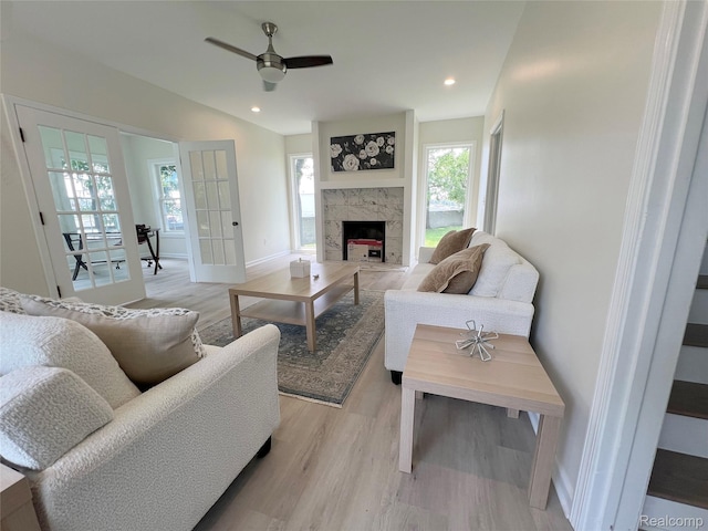 19904 Mckinnon St, Roseville, MI 48066 - living area with light wood-style flooring, ceiling fan, a fireplace, recessed lighting, and french doors