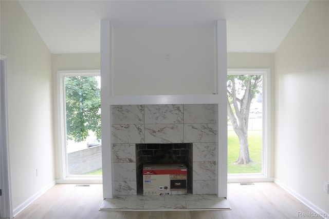 19904 Mckinnon St, Roseville, MI 48066 - detailed view of wood finished floors and a fireplace