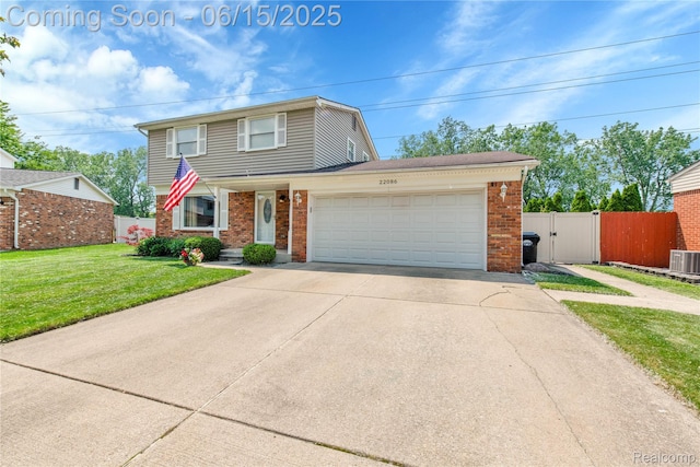 22086 Hillcrest Ct, Woodhaven, MI 48183 - traditional-style home with brick siding, an attached garage, concrete driveway, and a gate