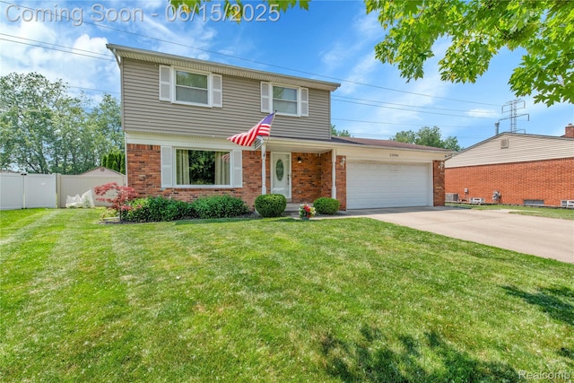 22086 Hillcrest Ct, Woodhaven, MI 48183 - view of front of property featuring brick siding, a garage, and driveway