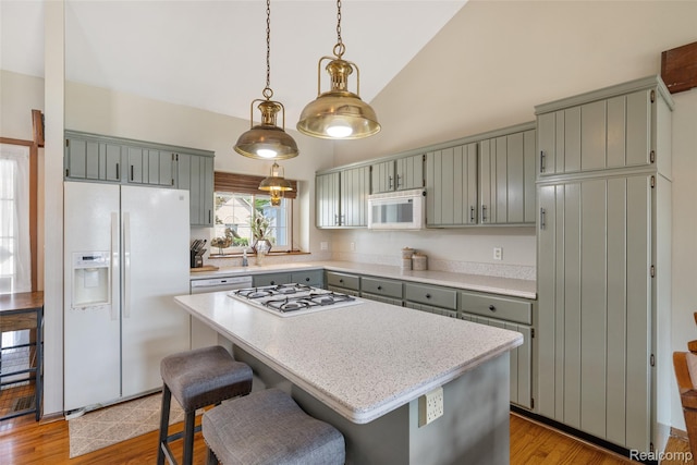 35772 Bal Clair St, New Baltimore, MI 48047 - kitchen featuring white appliances, high vaulted ceiling, light countertops, wine cooler, and pendant lighting