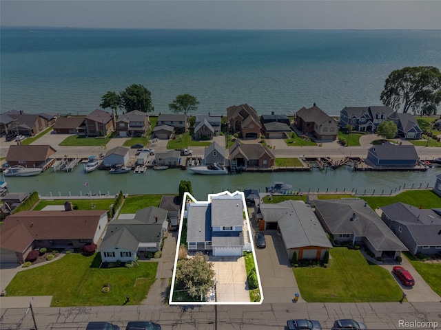 35772 Bal Clair St, New Baltimore, MI 48047 - aerial perspective of suburban area featuring a large body of water and property boundaries highlighted