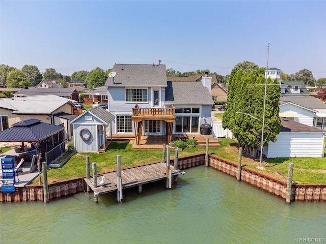 35772 Bal Clair St, New Baltimore, MI 48047 - rear view of property featuring a storage unit, a water view, a residential view, and a gazebo