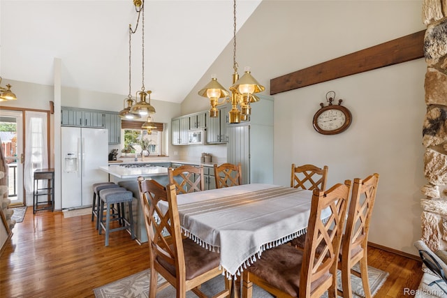 35772 Bal Clair St, New Baltimore, MI 48047 - dining room featuring wood finished floors, plenty of natural light, and high vaulted ceiling