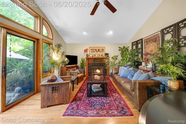 115 Audubon Dr, White Lake, MI 48383 - living room with ceiling fan, light wood-style flooring, high vaulted ceiling, a fireplace, and recessed lighting