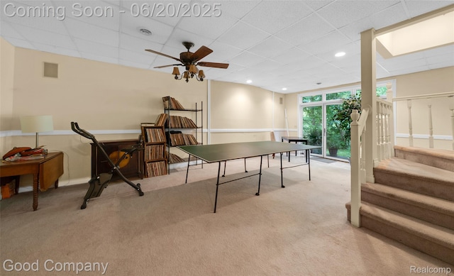 115 Audubon Dr, White Lake, MI 48383 - rec room featuring carpet, a paneled ceiling, and a ceiling fan