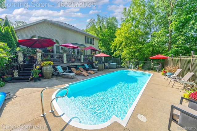 115 Audubon Dr, White Lake, MI 48383 - view of swimming pool featuring a fenced backyard, a patio, and a deck
