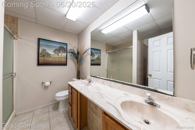 115 Audubon Dr, White Lake, MI 48383 - full bathroom with a stall shower, double vanity, a paneled ceiling, and tile patterned floors