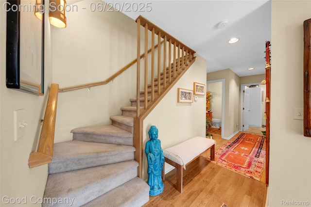 115 Audubon Dr, White Lake, MI 48383 - stairway with wood finished floors and recessed lighting