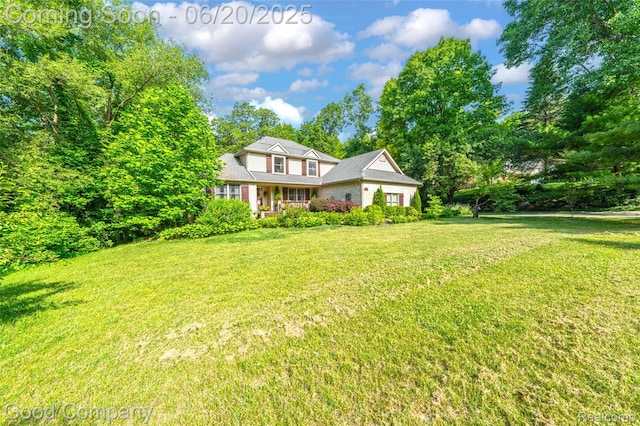 115 Audubon Dr, White Lake, MI 48383 - traditional home with a front lawn