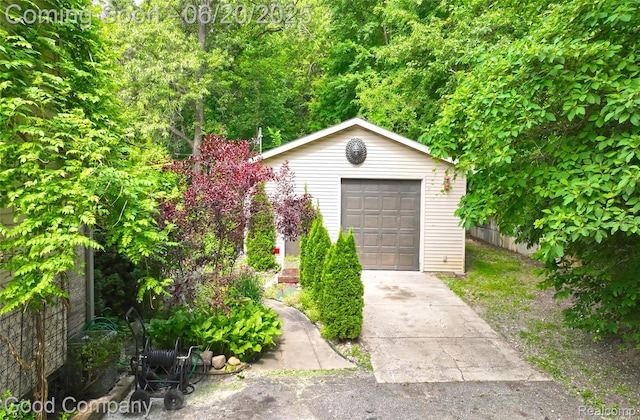 115 Audubon Dr, White Lake, MI 48383 - detached garage featuring concrete driveway
