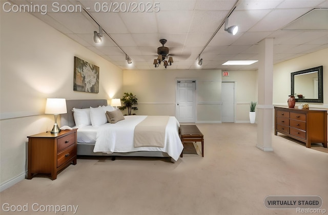 115 Audubon Dr, White Lake, MI 48383 - bedroom with rail lighting, light colored carpet, and a closet