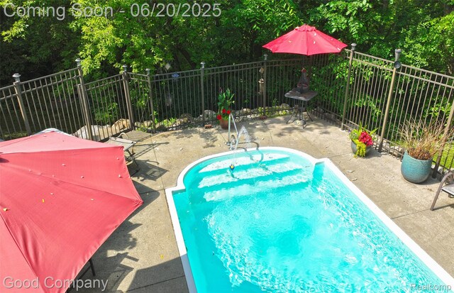 115 Audubon Dr, White Lake, MI 48383 - view of swimming pool featuring a patio area