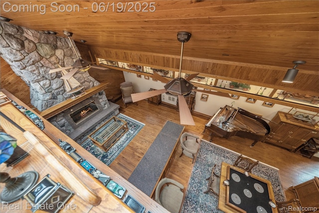 26044 York Rd, Huntington Woods, MI 48070 - living room featuring vaulted ceiling, hardwood / wood-style floors, ceiling fan, wooden ceiling, and a fireplace
