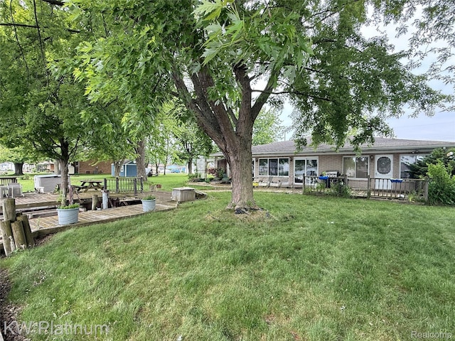 7275 Bluebill St, Clay, MI 48001 - view of green lawn with a wooden deck