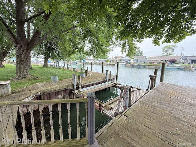 7275 Bluebill St, Clay, MI 48001 - dock area featuring a water view and a yard