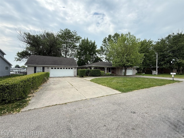 7275 Bluebill St, Clay, MI 48001 - ranch-style house with driveway, a garage, and a front yard