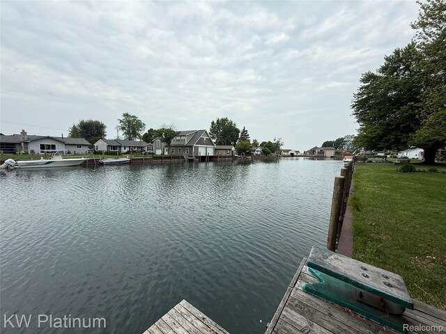 7275 Bluebill St, Clay, MI 48001 - dock area with a water view, a residential view, and a yard
