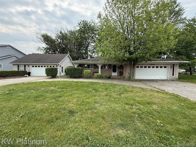 7275 Bluebill St, Clay, MI 48001 - ranch-style house with a front lawn, driveway, and a garage