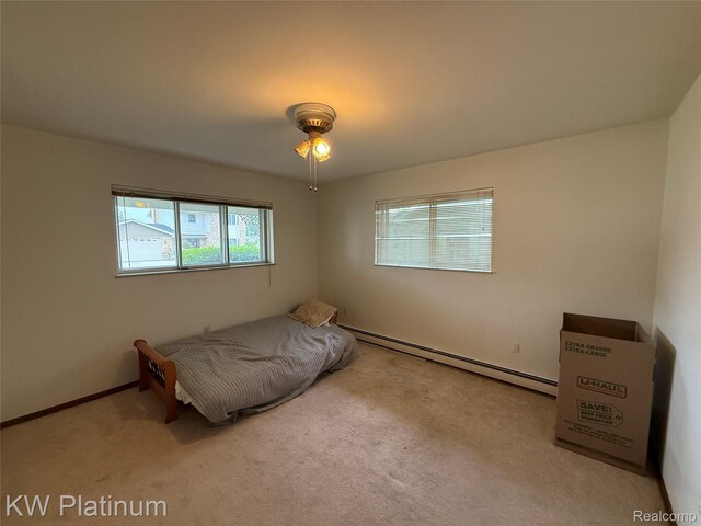 7275 Bluebill St, Clay, MI 48001 - unfurnished bedroom featuring a baseboard radiator and carpet