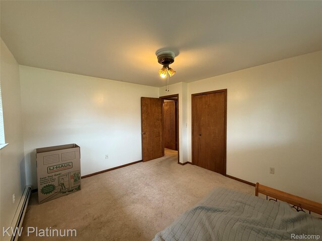 7275 Bluebill St, Clay, MI 48001 - unfurnished bedroom with a baseboard radiator, carpet, and a ceiling fan