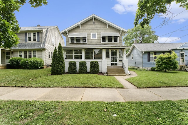 258 Richards Ave SW, Grand Rapids, MI 49504 - view of front facade with a sunroom and a front lawn